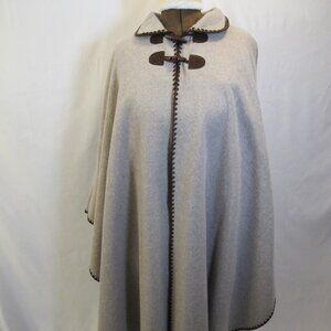 Amanda Smith tan cape with brown felt trim and button closure